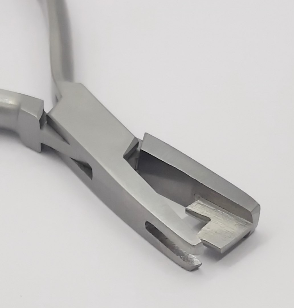 Orthodontic forceps for forming ligatures.